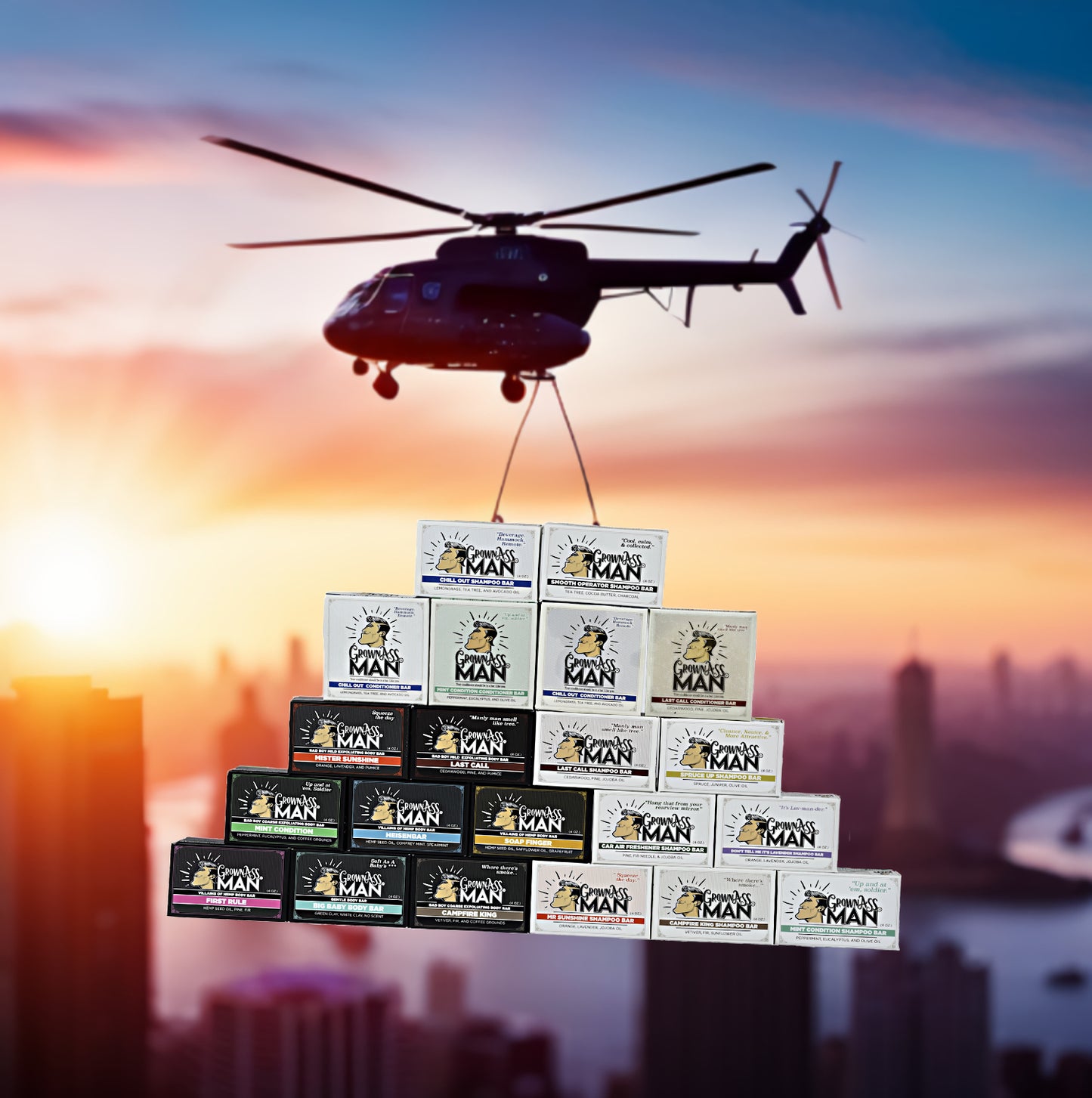 The Greater, Bigger, Everything-er Bundle shampoo, conditioner & body bars stacked on top of each other and staged as a cargo drop from a helicopter